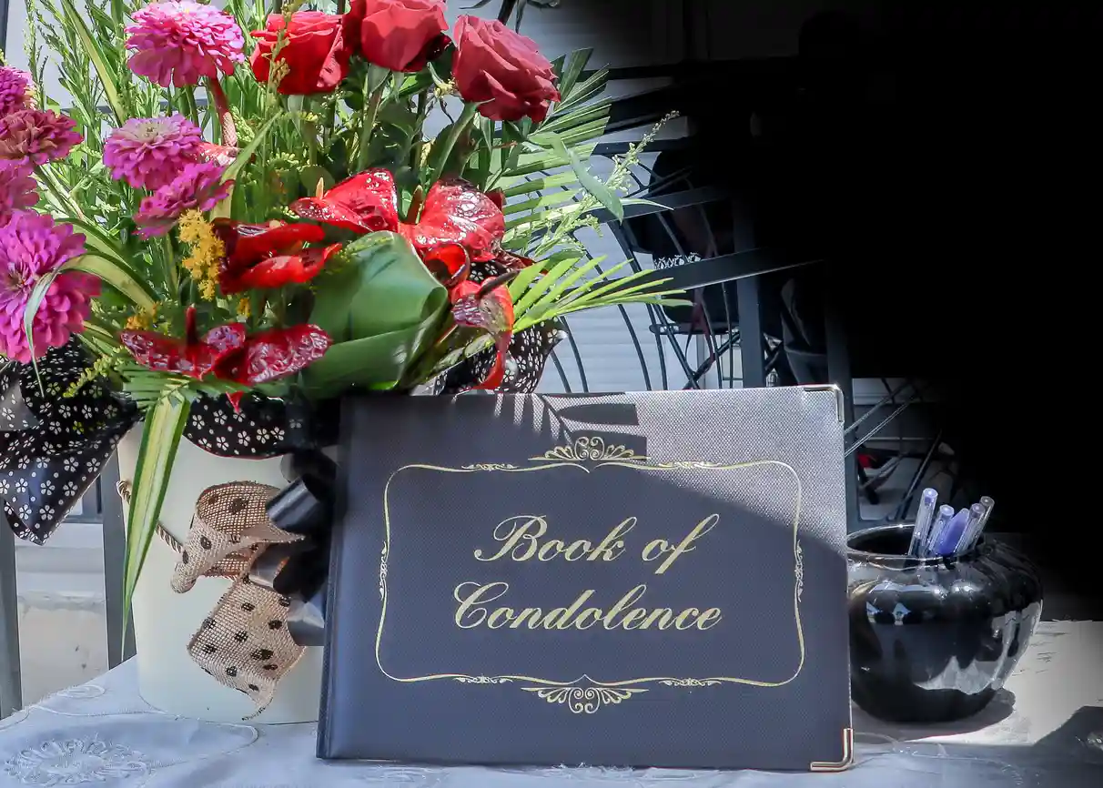 Condolence book and flowers