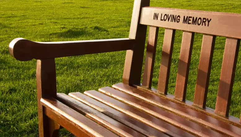 memorial services in wirral. Image of memorial bench in park
